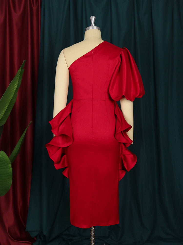 Dame cocktail dress with asymmetric cut and voluminous ruffle design Mirla-Eva Jonsson