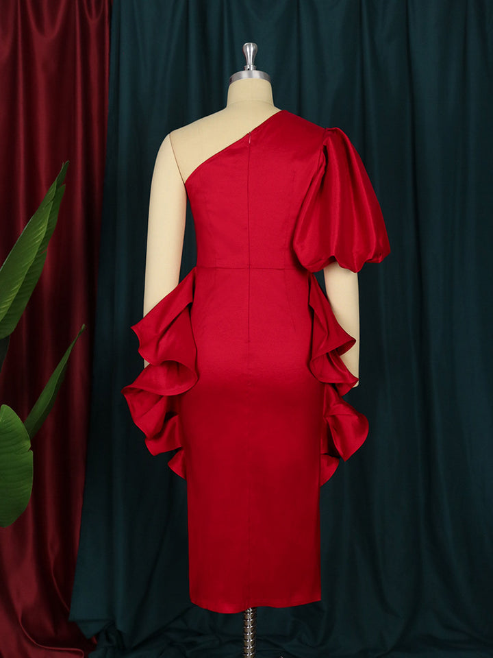 Dame cocktail dress with asymmetric cut and voluminous ruffle design Mirla-Eva Jonsson