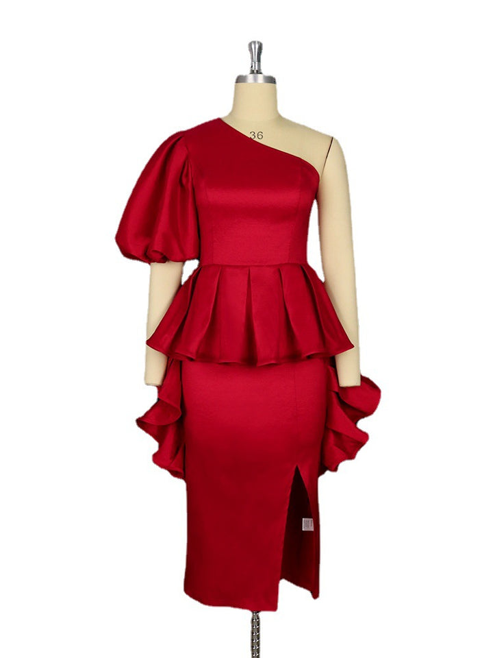 Dame cocktail dress with asymmetric cut and voluminous ruffle design Mirla-Eva Jonsson