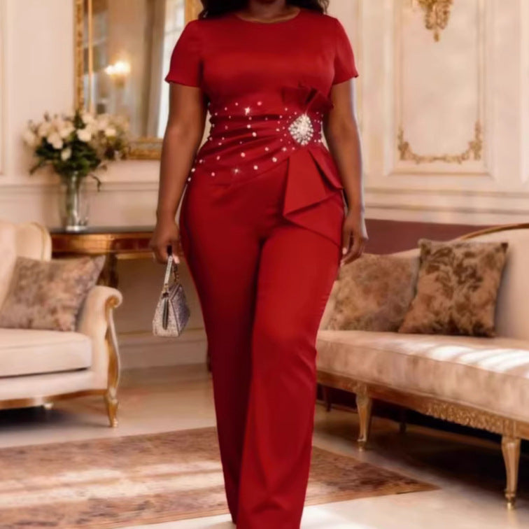 Dame elegant jumpsuit med figuranpassad silhuett och volangdetaljer Mirla-Eva Jonsson