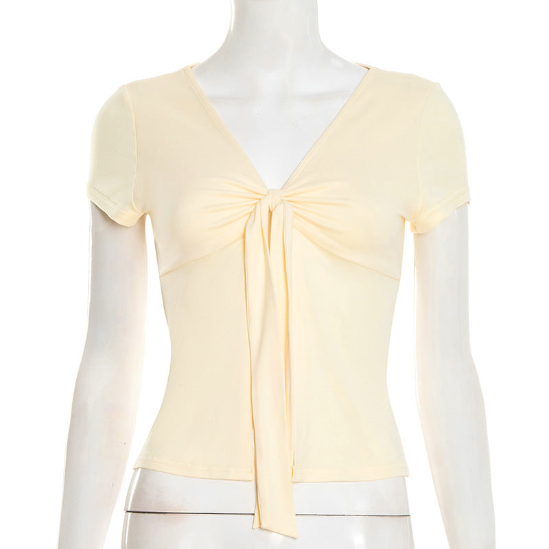 Dame elegant wrap top med dekorativ knut och djup V-hals Mirla-Eva Jonsson