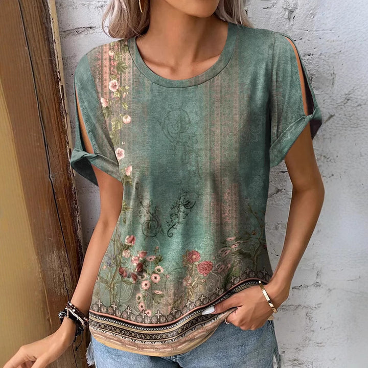 Dame floral oversized t-shirt med cut-out ärmar Mirla-Eva Jonsson