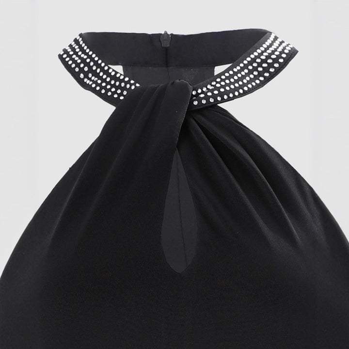 Dame glamorös kvällsklänning med chiffon-snitt och glittrande halsområde Mirla-Eva Jonsson