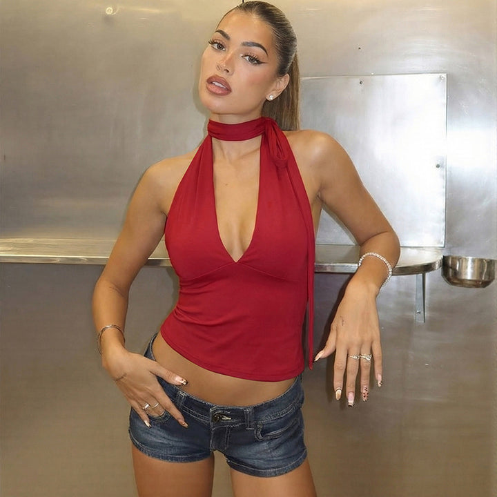 Dame halter neck top med djupt V-ringning och rosett detalj Mirla-Eva Jonsson
