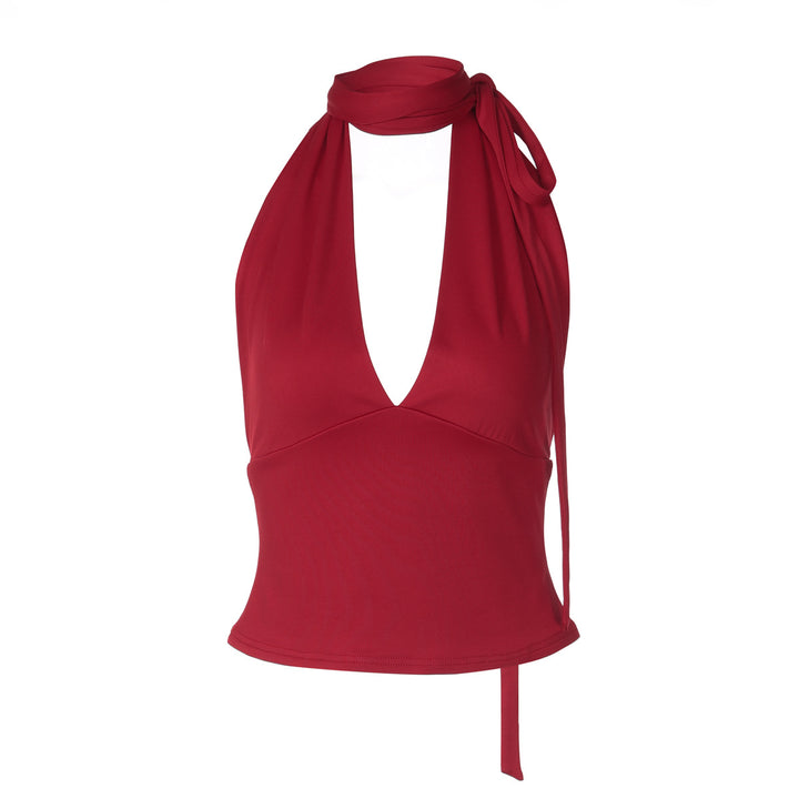 Dame halter neck top med djupt V-ringning och rosett detalj Mirla-Eva Jonsson
