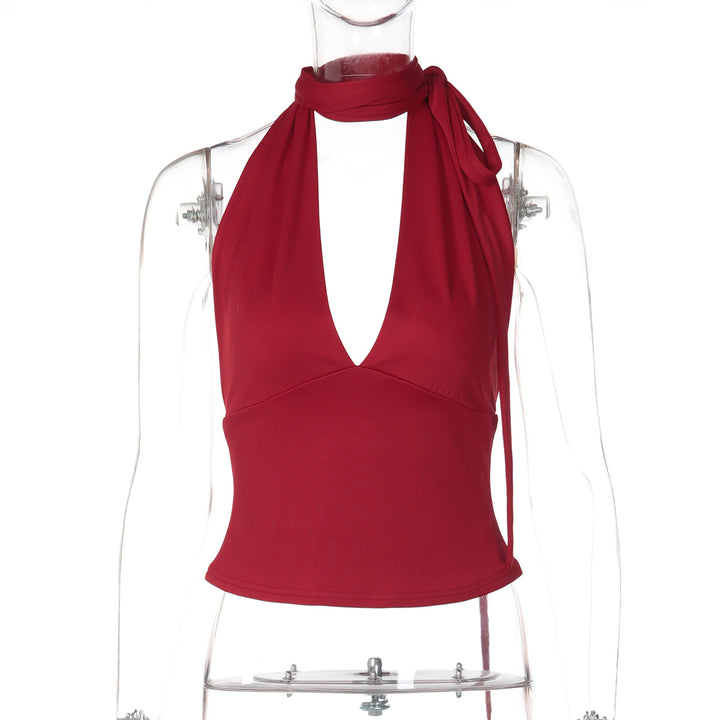 Dame halter neck top med djupt V-ringning och rosett detalj Mirla-Eva Jonsson