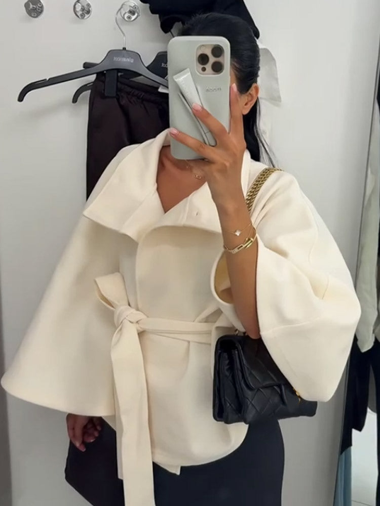 Dame hooded coat with fashionable belt and voluminous sleeves Mirla-Eva Jonsson