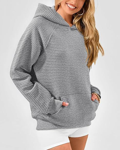 Dame hoodie med strukturerad yta och praktisk känguruficka Eva Jonsson-Eva Jonsson