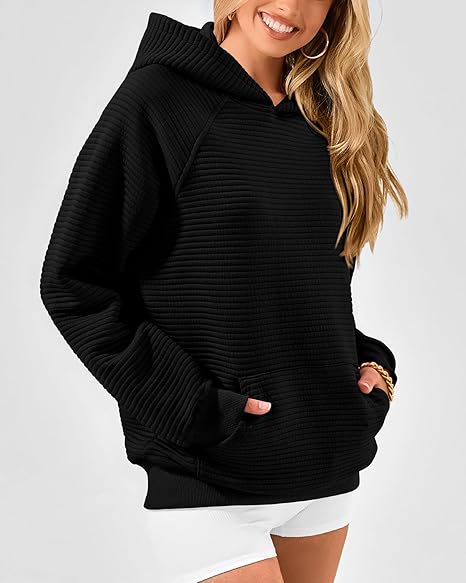 Dame hoodie med strukturerad yta och praktisk känguruficka Eva Jonsson-Eva Jonsson