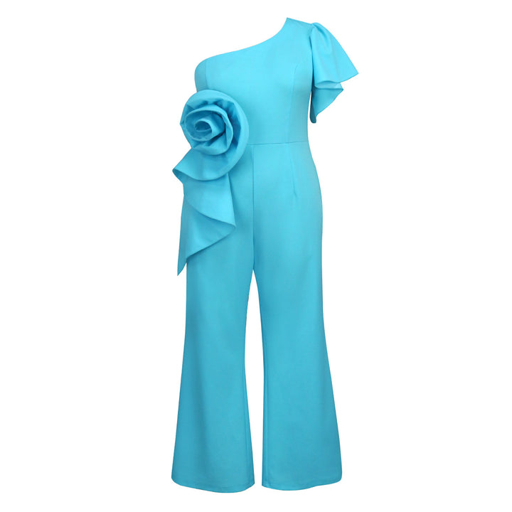 Dame jumpsuit med asymmetrisk skärning och voluminös blomsteraccent Mirla-Eva Jonsson