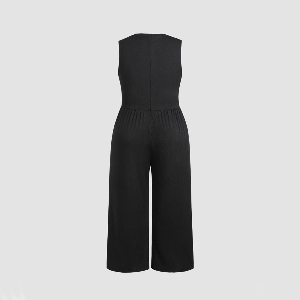 Dame jumpsuit med elegant off-shoulder design och praktiska sidofickor Mirla-Eva Jonsson
