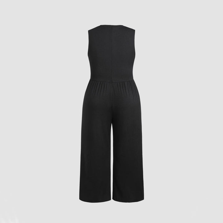 Dame jumpsuit med elegant off-shoulder design och praktiska sidofickor Mirla-Eva Jonsson