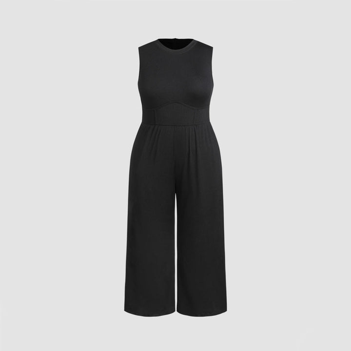 Dame jumpsuit med elegant off-shoulder design och praktiska sidofickor Mirla-Eva Jonsson