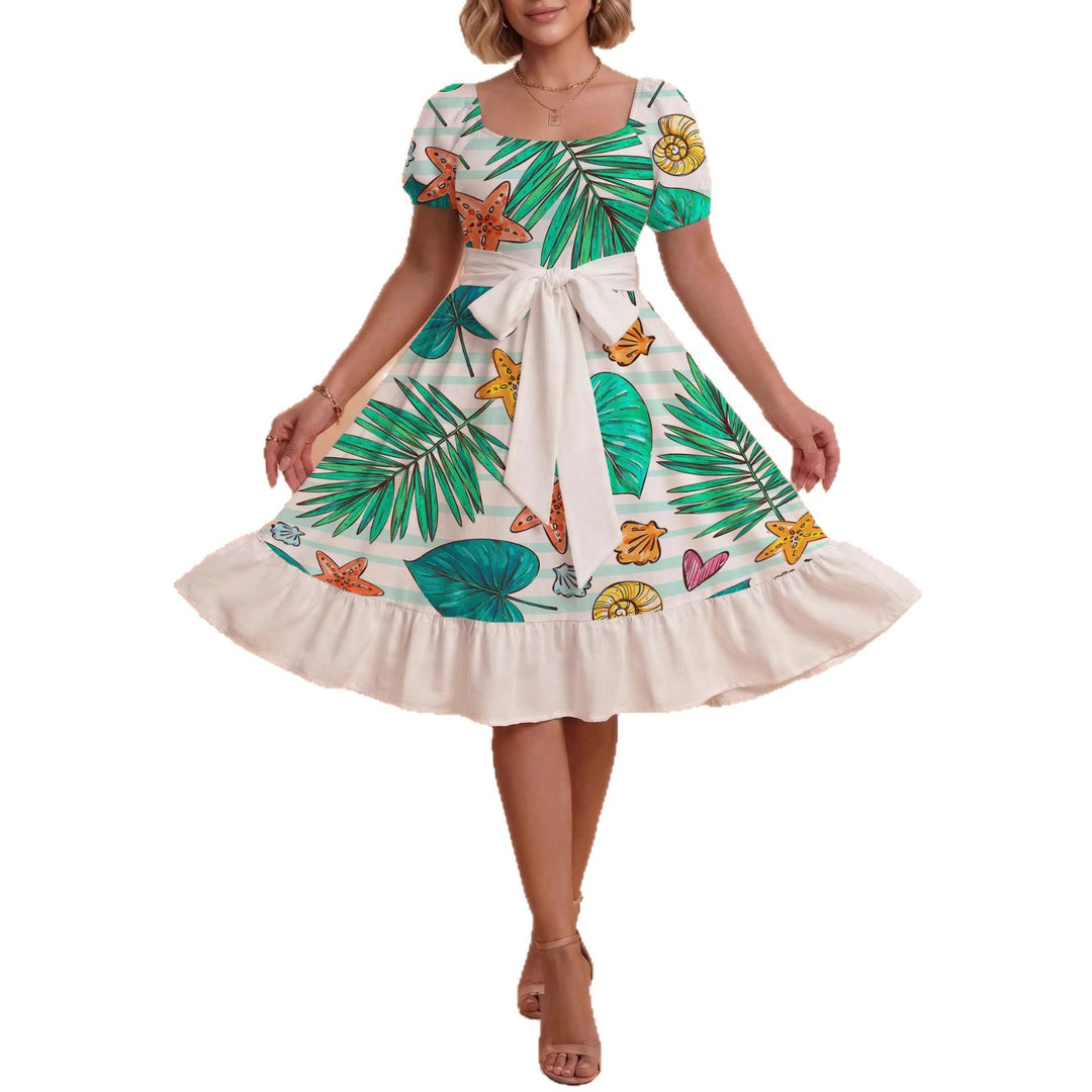 Dame klänning med figursydd snitt och lekfullt blommönster Mirla-Eva Jonsson