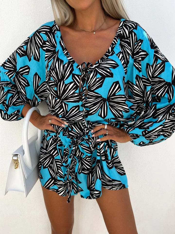 Dame kortärmad jumpsuit med blommönster Mirla-Eva Jonsson