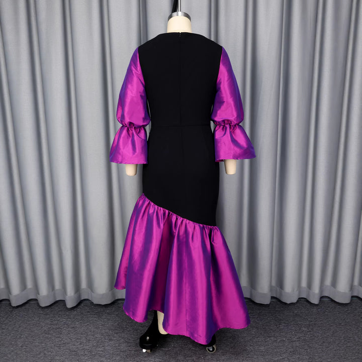 Dame kvällsklänning med voluminösa ärmar och elegant fåll Mirla-Eva Jonsson
