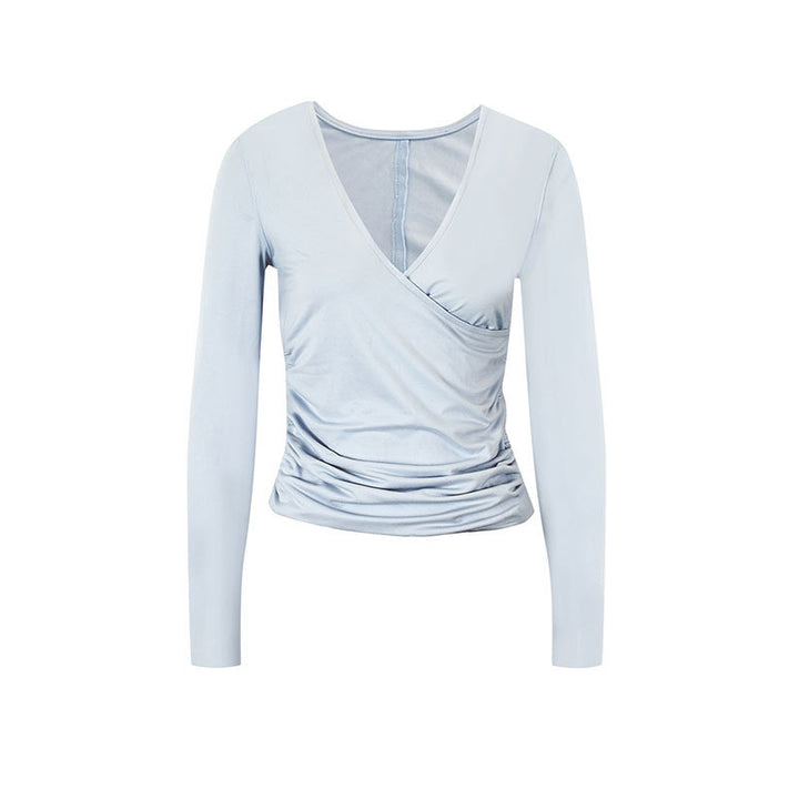 Dame långärmad skjorta med raffinerad inwrapdesign och eleganta ruffledetaljer Mirla-Eva Jonsson