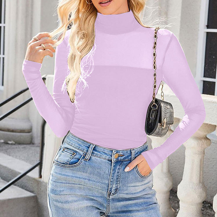 Dame långärmad tröja med elegant drapering och transparent design Mirla-Eva Jonsson
