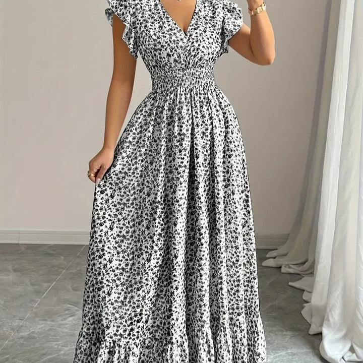 Dame maxiklänning med blommigt volangdesign och elastisk midjedel Mirla-Eva Jonsson