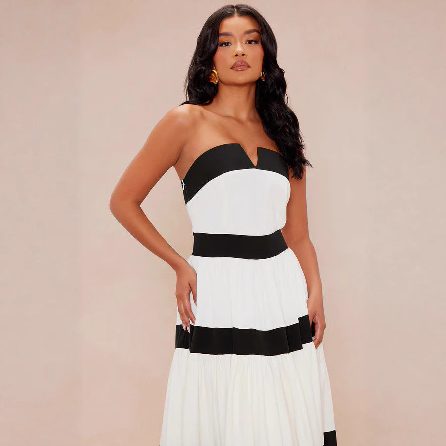 Dame maxiklänning med off-shoulder design och vid kjol Mirla-Eva Jonsson