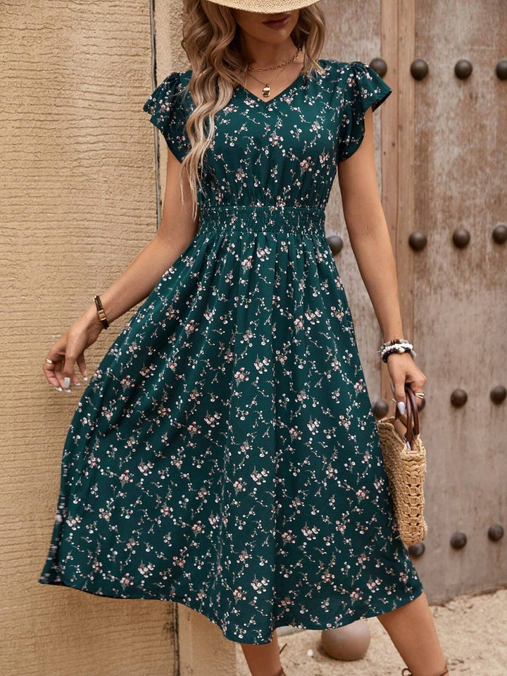 Dame midiklänning med blommönster och rynkor Mirla-Eva Jonsson