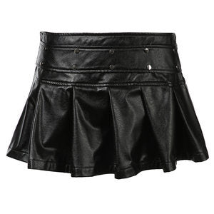 Dame mini skirt in faux leather with ruffles and decorative studs Mirla-Eva Jonsson