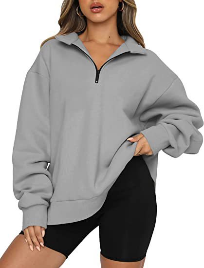 Dame mode oversized tröja med kort dragkedja och avslappnade ärmar Mirla-Eva Jonsson