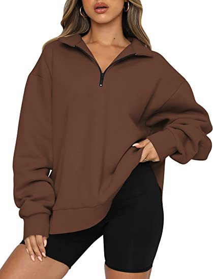 Dame mode oversized tröja med kort dragkedja och avslappnade ärmar Mirla-Eva Jonsson