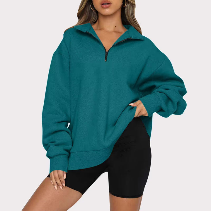 Dame mode oversized tröja med kort dragkedja och avslappnade ärmar Mirla-Eva Jonsson
