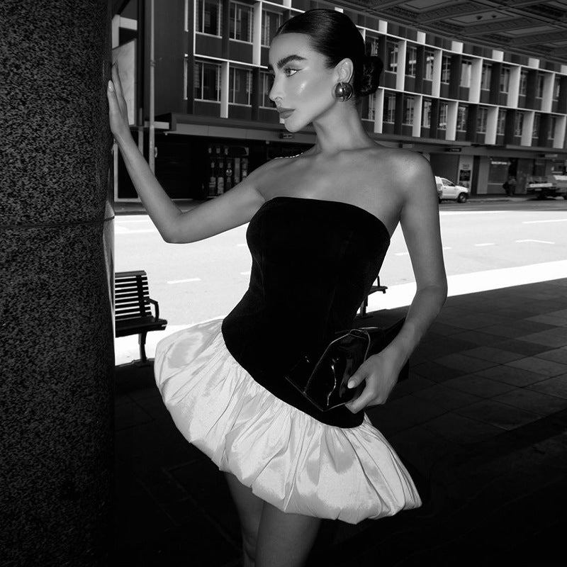Dame off-shoulder wrap dress with asymmetrical hem and color contrasting ruffle Mirla-Eva Jonsson