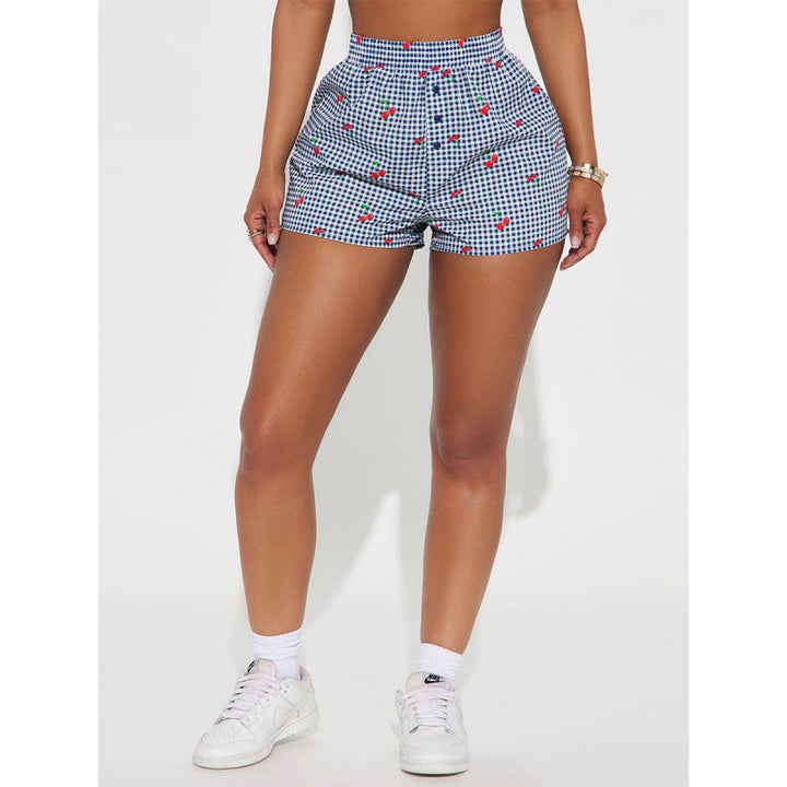 Dame shorts med glad rutmönster och lekfullt frukttryck Mirla-Eva Jonsson