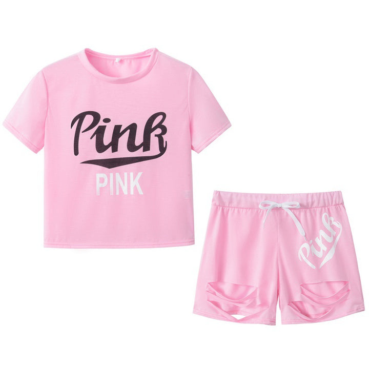 Dame sportig t-shirt och shorts set med löst passform och kontrasterande tryck Mirla-Eva Jonsson