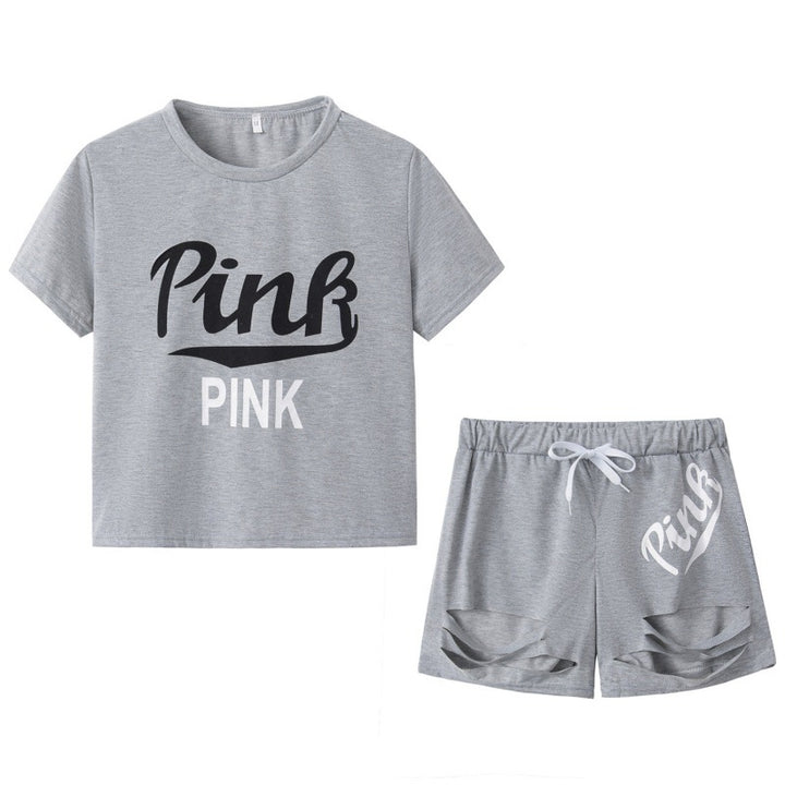Dame sportig t-shirt och shorts set med löst passform och kontrasterande tryck Mirla-Eva Jonsson