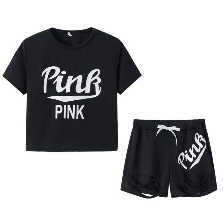 Dame sportig t-shirt och shorts set med löst passform och kontrasterande tryck Mirla-Eva Jonsson