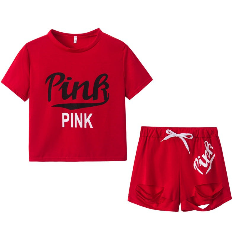 Dame sportig t-shirt och shorts set med löst passform och kontrasterande tryck Mirla-Eva Jonsson