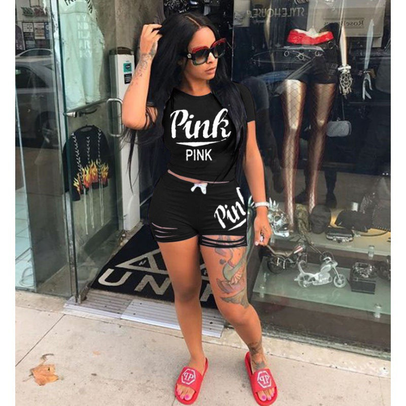 Dame sportig t-shirt och shorts set med löst passform och kontrasterande tryck Mirla-Eva Jonsson