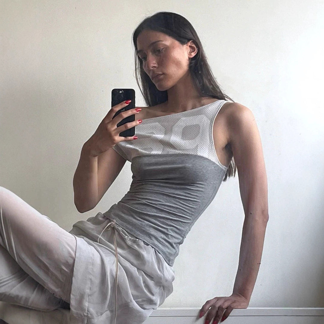 Dame sporttop med modernt nätdesign och figurnära passform Mirla-Eva Jonsson