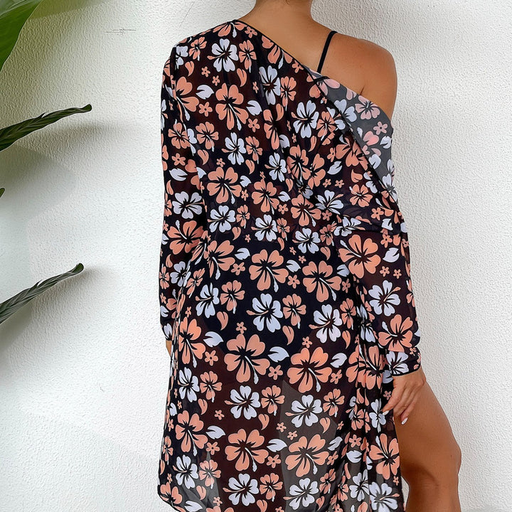 Dame strandcover-up med blommigt mönster och elegant transparens Mirla-Eva Jonsson