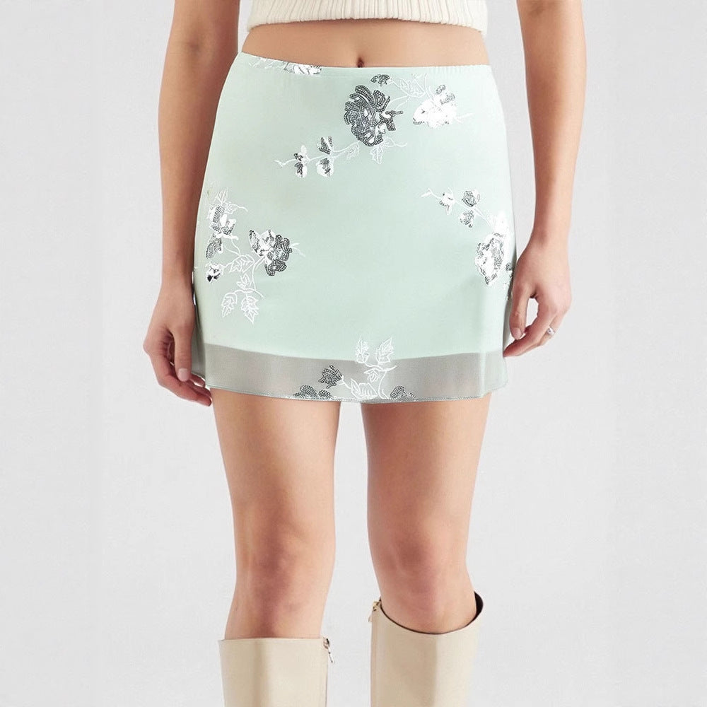 Dame transparent skirt with floral design and glittering accents Mirla-Eva Jonsson