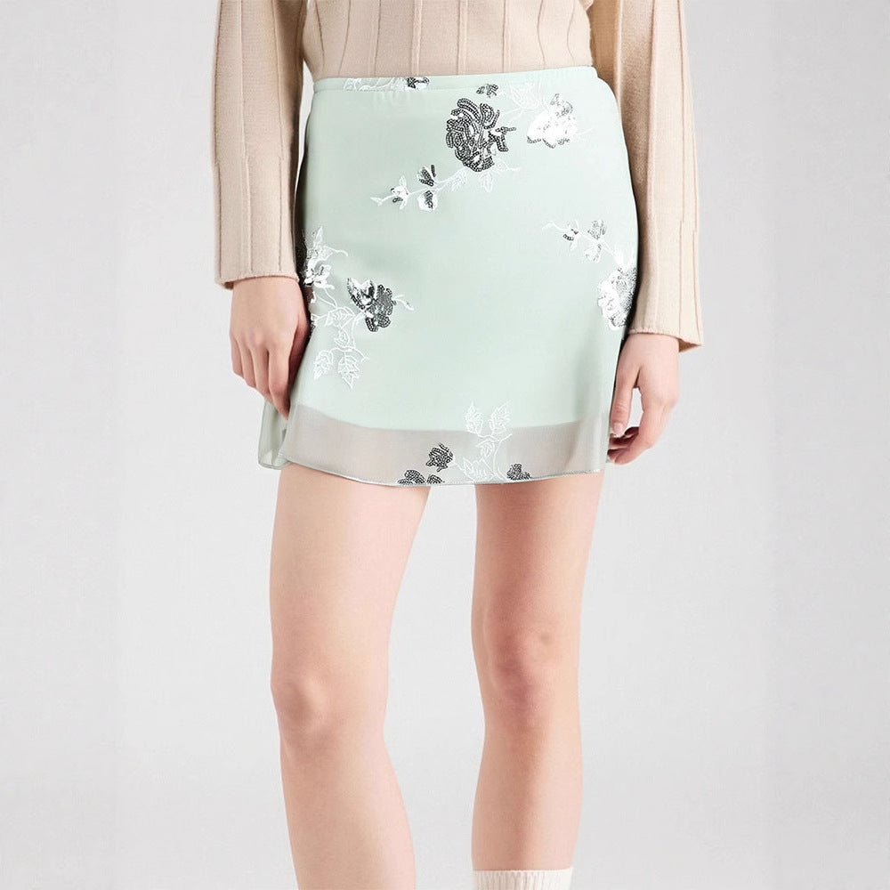 Dame transparent skirt with floral design and glittering accents Mirla-Eva Jonsson