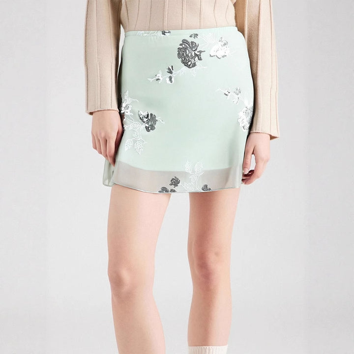 Dame transparent skirt with floral design and glittering accents Mirla-Eva Jonsson