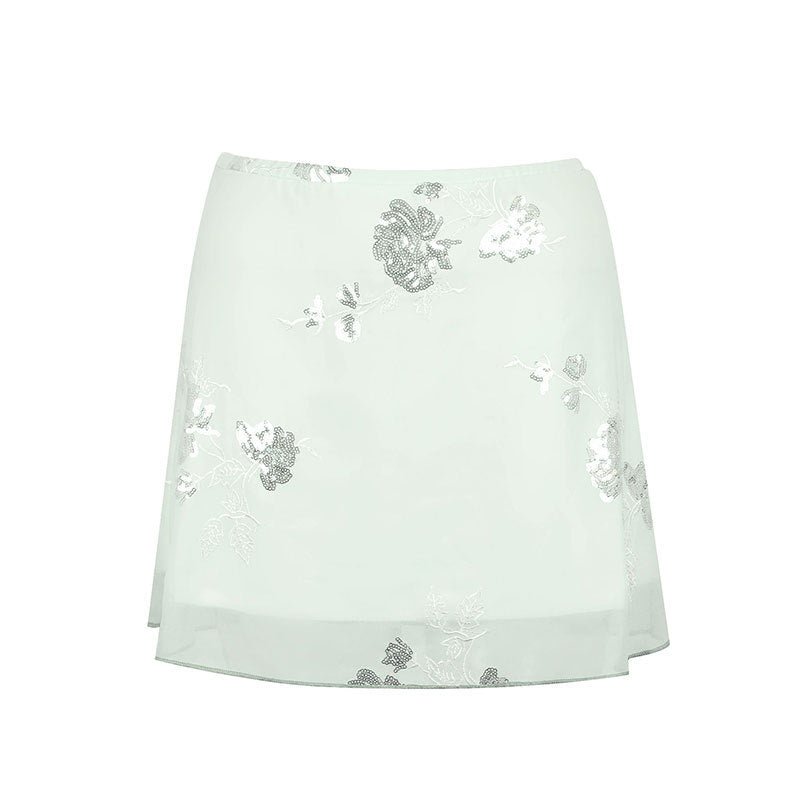 Dame transparent skirt with floral design and glittering accents Mirla-Eva Jonsson