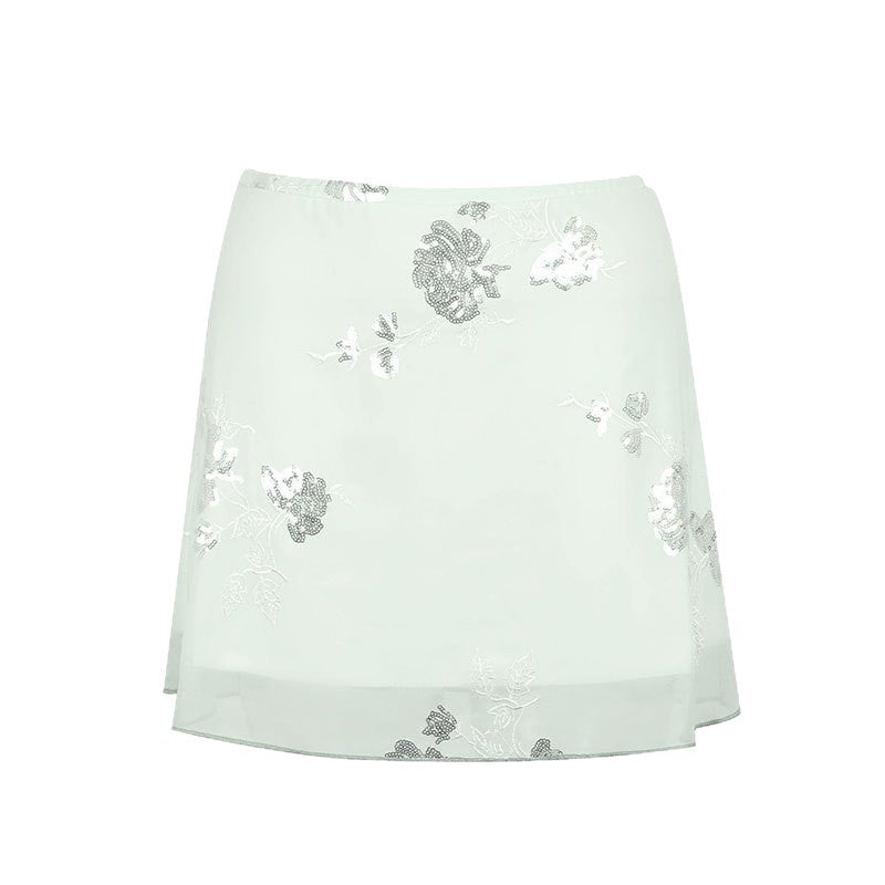 Dame transparent skirt with floral design and glittering accents Mirla-Eva Jonsson