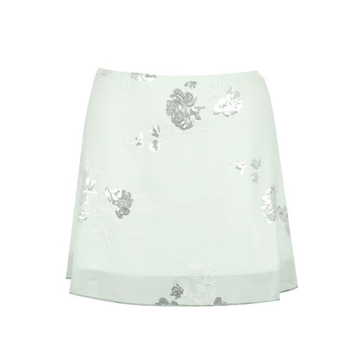 Dame transparent skirt with floral design and glittering accents Mirla-Eva Jonsson