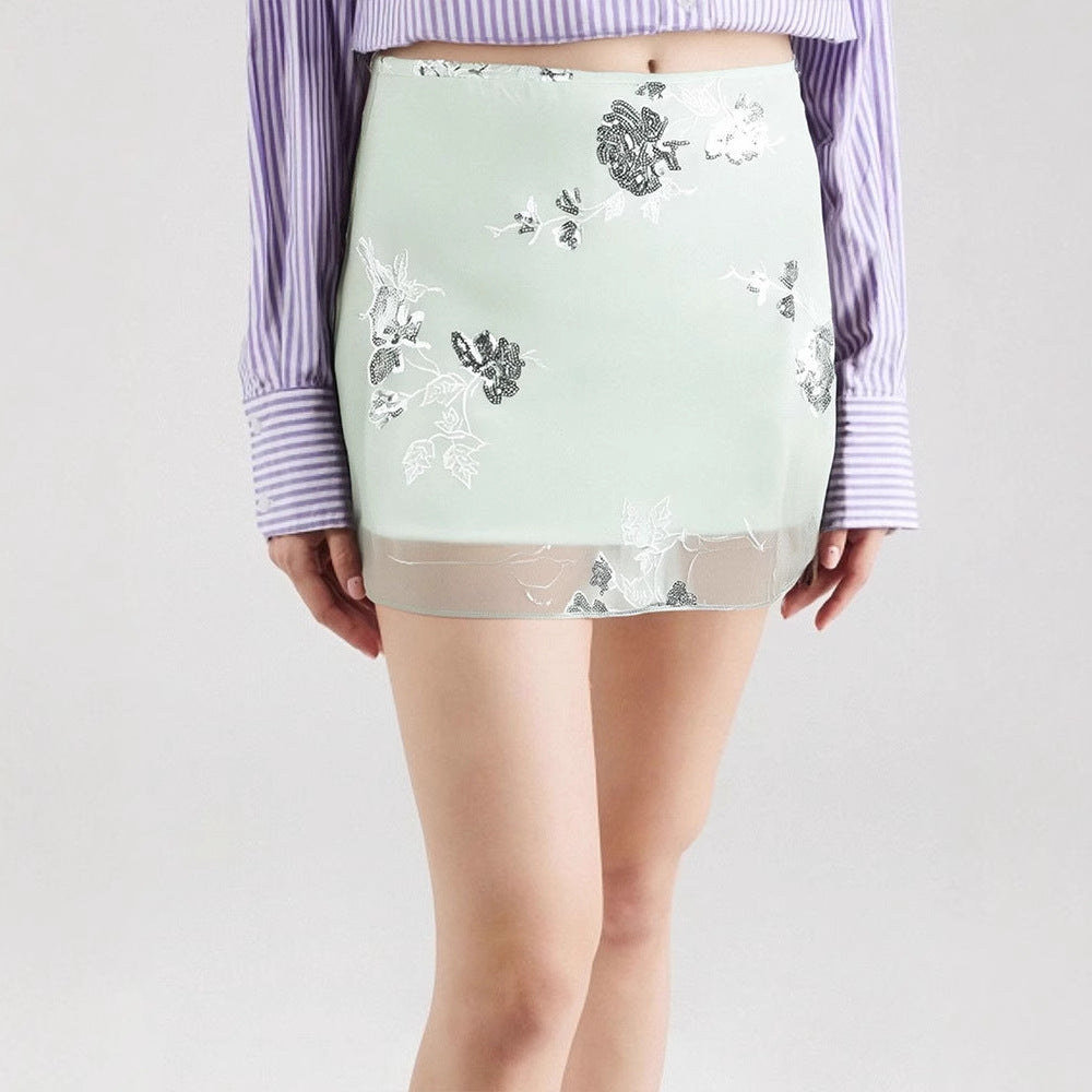 Dame transparent skirt with floral design and glittering accents Mirla-Eva Jonsson