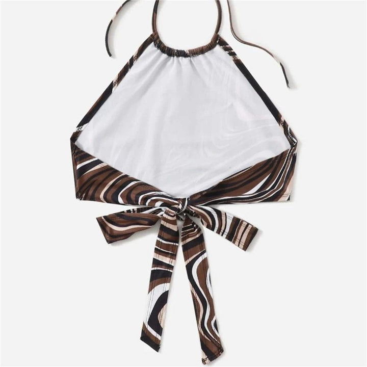 Dame trendy halter-top med elegant omslagsdesign och grafiskt tryck Mirla-Eva Jonsson