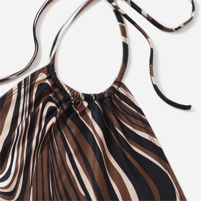 Dame trendy halter-top med elegant omslagsdesign och grafiskt tryck Mirla-Eva Jonsson