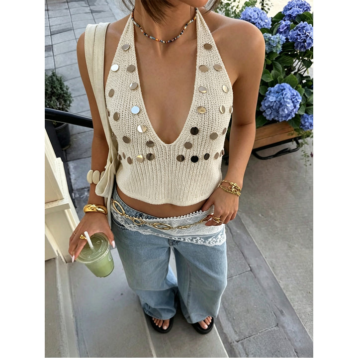 Dame trendy stickad topp med djup V-ringning och modiga metallic detaljer Mirla-Eva Jonsson
