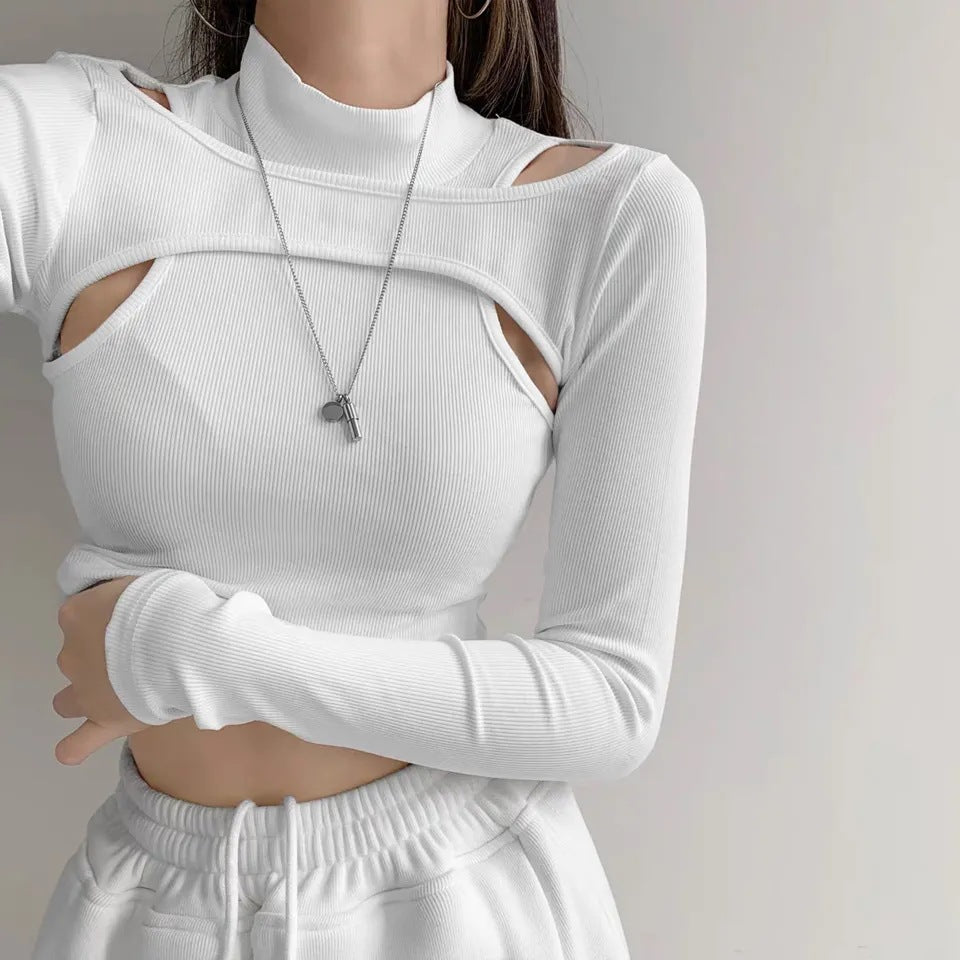Dame trendy top med cut-outs och hög krage Mirla-Eva Jonsson