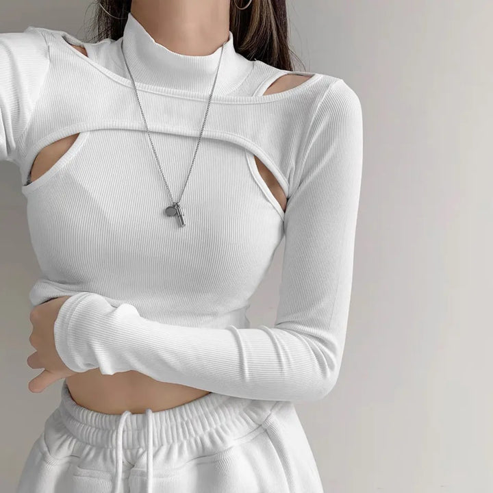 Dame trendy top med cut-outs och hög krage Mirla-Eva Jonsson